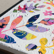 Load image into Gallery viewer, A closeup of a colorful abstract painting painted over with white to show designs of plants and nature in the negative space.