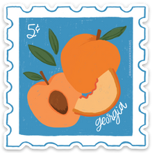 Load image into Gallery viewer, An illustrated 5c postage stamp with 3 peaches (one whole, one halved, and one slice) with a blue background and some leaves. It says Georgia in the bottom corner.