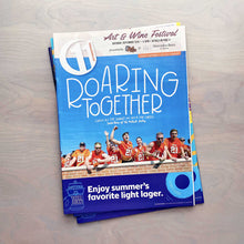 Load image into Gallery viewer, Roaring Together hand lettered in the sky above excited Mercer students watching a Mercer football game on the cover of 11th Hour magazine