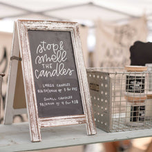 Load image into Gallery viewer, Hand lettered sign that says "stop and smell the candles" with pricing information for purchasing the 7th Street Salvage's candles.