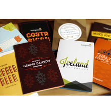 Load image into Gallery viewer, living social pamphlets/books layed out on a table