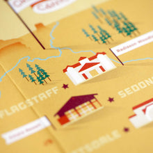 Load image into Gallery viewer, zoomed in photo of an orange map with small trees and houses on it