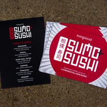 Load image into Gallery viewer, Two living social prints stacked next to eachother on granite background. The left is a menu for "sumo sushi" and the right is an advertisement for "sumo sushi" with a red circle and lines in the background.