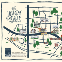 Load image into Gallery viewer, Painted neighborhood map labeled "the historic vineville neighborhood" with black lines and painted buildings and trees.eenery in the background