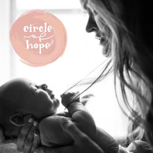 Load image into Gallery viewer, A black and white picture of mother holding her child and in the top left corner there's the Circle of Hope logo. A logo consists of a circle of shades of pink with white lettering inside. The lettering says "circle of hope" where "circle" and "hope" are a hand drawn serif typography and "of" is a cursive monoline typography.