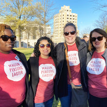 Load image into Gallery viewer, Four women wearing macon periods easier shirts smiling with the city of macon in the background