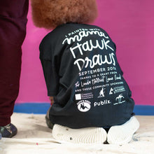 Load image into Gallery viewer, Photo of the back of a painter's shirt with "I painted with mama hawk draws september 2019" printed in white lettering