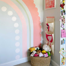 Load image into Gallery viewer, Detail look of the rainbow behind a basket of stuffed animals. The outermost stripe is salmon pink and has scalloped edges. The second stripe is about an 1in thick and is sage green. The third stripe is a mid tone pink about 3in wide.The last stripe is light pink circle.