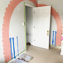 Load image into Gallery viewer, The first stripe of B's rainbow is complete with bubbly scallops. You can also see the chalk outlines for the other rainbow stripes, as well as the painter's tape used to keep straight lines.
