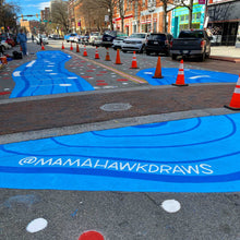 Load image into Gallery viewer, Shot of completed crosswalk mural with @mamahawkdraws painted in foreground