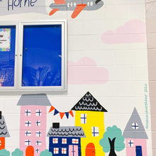 Load image into Gallery viewer, Close up of the right of the "habits at home" mural with buildings and trees and faint pink clouds