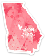 Load image into Gallery viewer, State of Georgia sticker with red and pink watercolor shaded pattern. Small white heart and text "macon, georgia" off right center of the sticker.