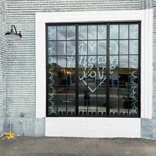 Load image into Gallery viewer, Glass window with black panes with "macon love" painted inside a heart shape inside