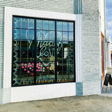 Load image into Gallery viewer, Glass window with black panes with "macon love" painted inside a heart shape inside