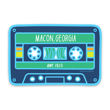 Load image into Gallery viewer, A stylized cassette tape design with colors light blue, navy blue, green, yellow, orange, and white. Text &quot;Macon, Georgia&quot; and &quot;est. 1823&quot; are printed in white on the design.
