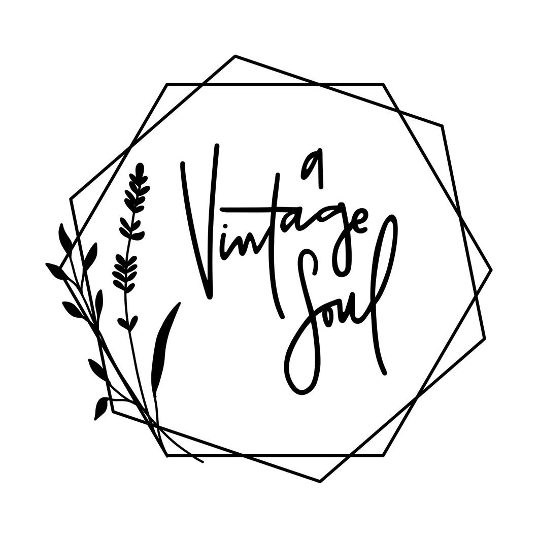 A Vintage Soul's hand lettered and hand drawn logo. The typography is a messy cursive and is surrounded by geometric hexagons and a lavender sprig all in black.
