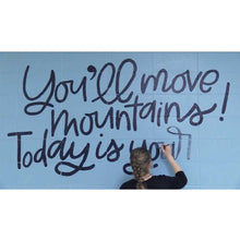 Load image into Gallery viewer, Mama Hawk Draws painting &quot;you&#39;ll move mountains&quot; black lettering on blue wall
