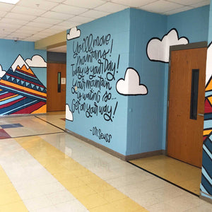 side view of the "you'll move mountains" mural with abstract mountain in the left corner
