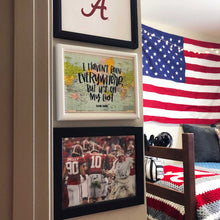 Load image into Gallery viewer, Photo of a room with three frames on a wall; the middle is the multicolored map of the world with handlettering
