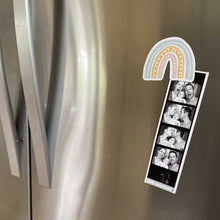 Load image into Gallery viewer, Pink, yellow, and blue rainbow magnet holding up family photos on a fridge
